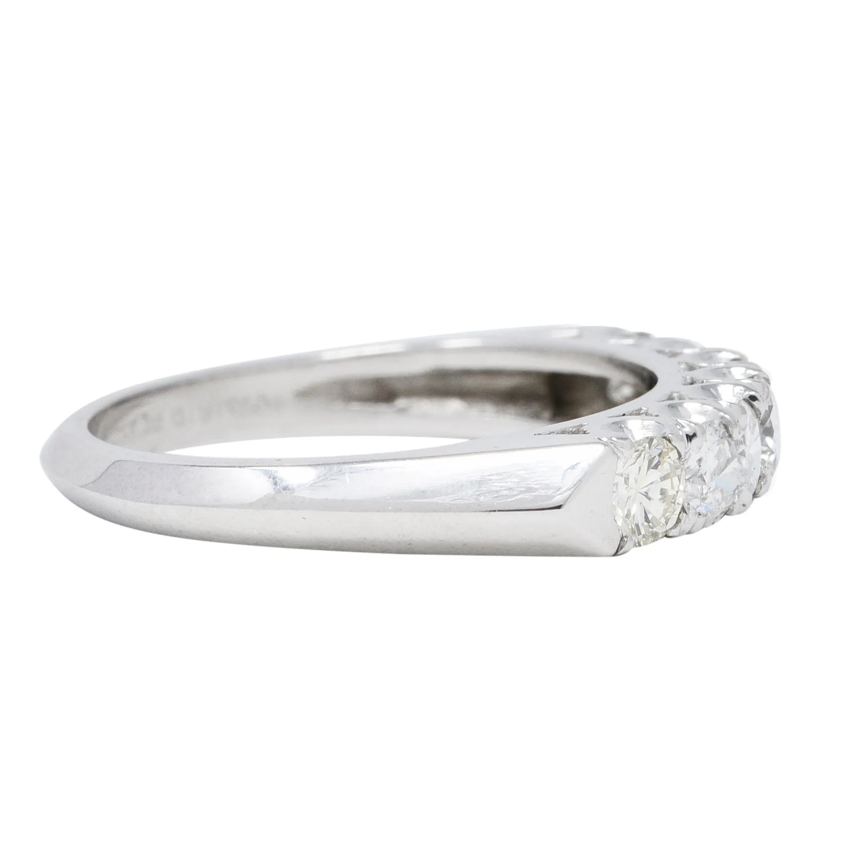 Mid-Century 0.70 CTW Diamond Platinum Seven Stone Vintage Fishtail Band Ring
