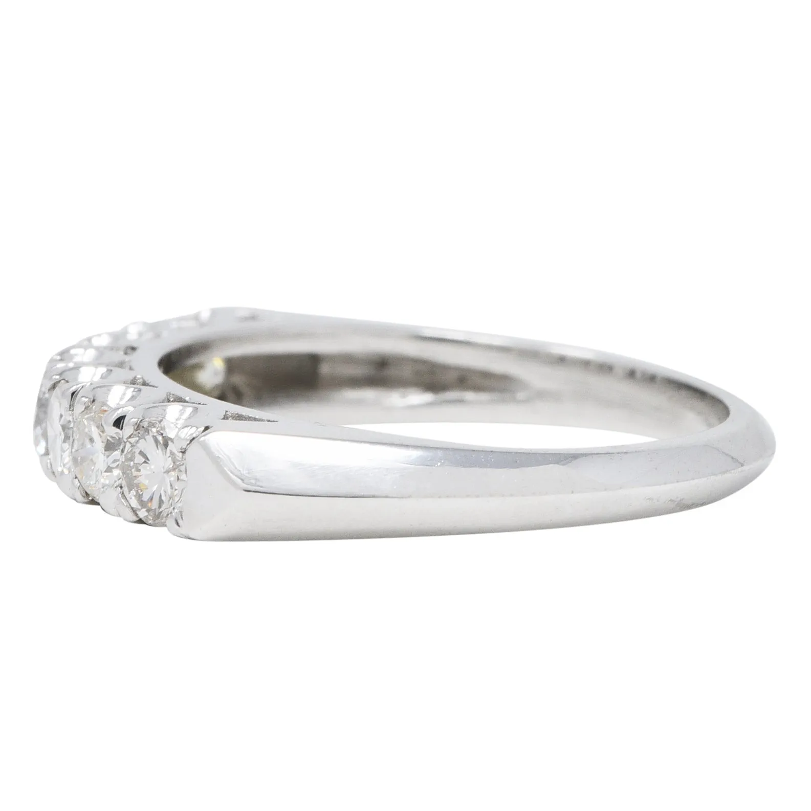 Mid-Century 0.70 CTW Diamond Platinum Seven Stone Vintage Fishtail Band Ring